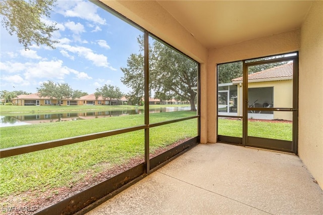 9322 Aegean Cir, Lehigh Acres, FL 33936 - unfurnished sunroom with a water view