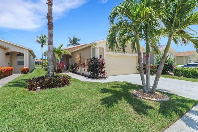 8644 Ibis Cove Cir, Naples, FL 34119 - view of front of property with stucco siding, concrete driveway, a garage, and a front lawn