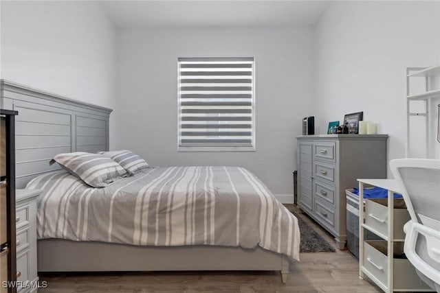 8644 Ibis Cove Cir, Naples, FL 34119 - bedroom with wood finished floors