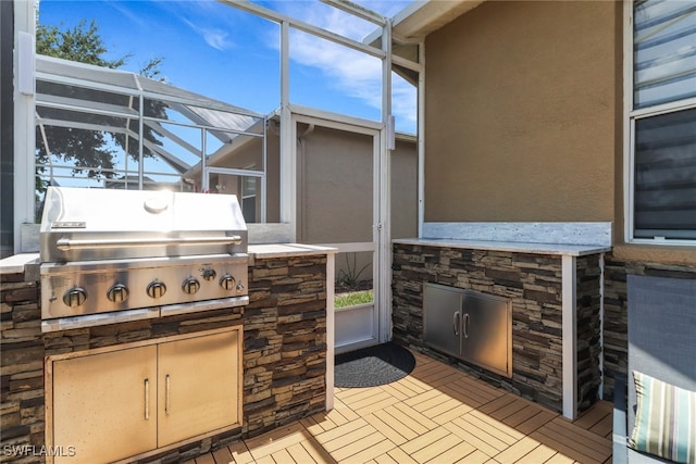 8644 Ibis Cove Cir, Naples, FL 34119 - view of patio / terrace with exterior kitchen and glass enclosure