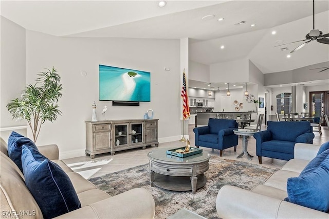 8644 Ibis Cove Cir, Naples, FL 34119 - living room featuring a ceiling fan, lofted ceiling, recessed lighting, and tile patterned flooring