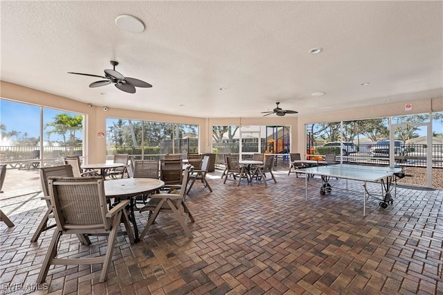8644 Ibis Cove Cir, Naples, FL 34119 - view of patio with outdoor dining area and ceiling fan