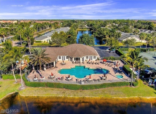 8644 Ibis Cove Cir, Naples, FL 34119 - bird's eye view of a pool area and a nearby body of water