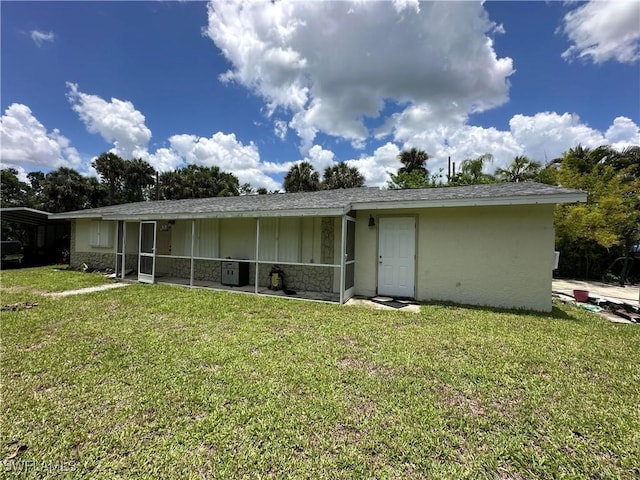 16940 Tarpon Way N, Fort Myers, FL 33917 - back of property featuring a lawn and board and batten siding