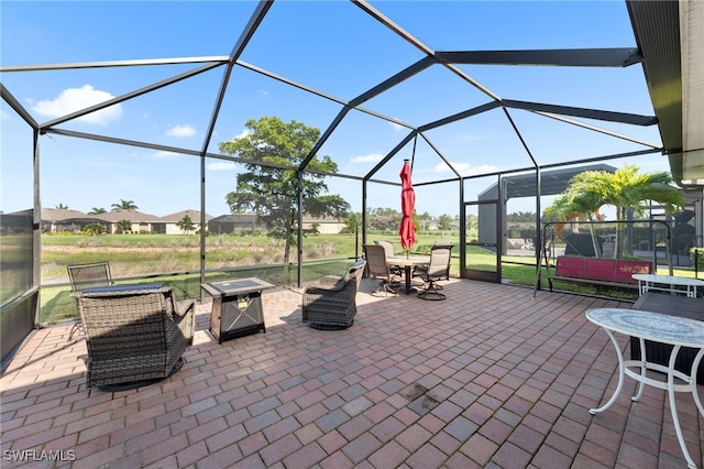 2245 Pigeon Plum Way N, Fort Myers, FL 33917 - view of patio / terrace featuring a fire pit and glass enclosure