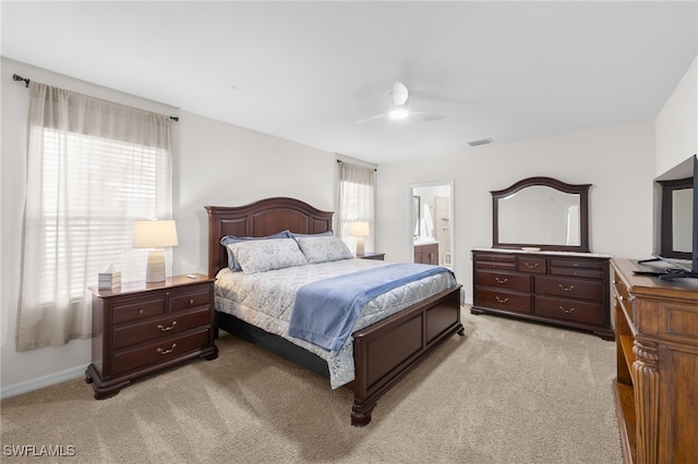 2245 Pigeon Plum Way N, Fort Myers, FL 33917 - bedroom with light colored carpet, ensuite bathroom, and ceiling fan