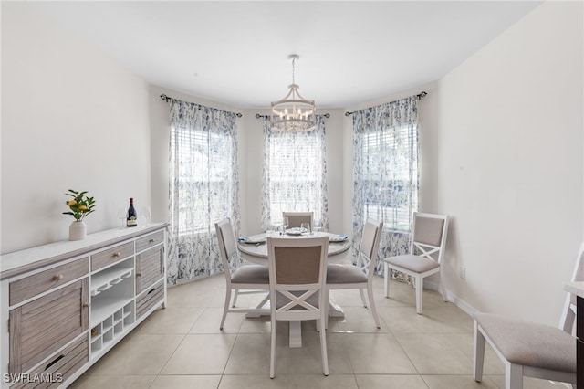 2245 Pigeon Plum Way N, Fort Myers, FL 33917 - dining room featuring a chandelier, plenty of natural light, and light tile patterned floors