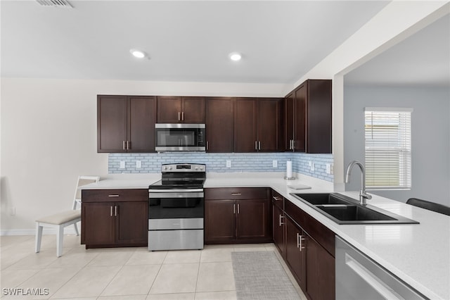 2245 Pigeon Plum Way N, Fort Myers, FL 33917 - kitchen with stainless steel appliances, light countertops, backsplash, and recessed lighting