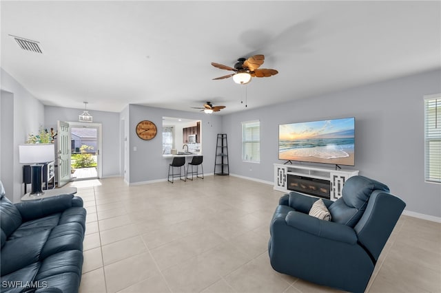 2245 Pigeon Plum Way N, Fort Myers, FL 33917 - living area with ceiling fan, plenty of natural light, and light tile patterned floors