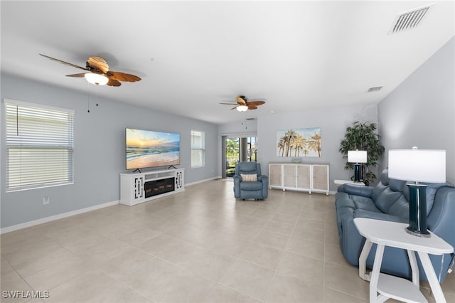 2245 Pigeon Plum Way N, Fort Myers, FL 33917 - living room featuring a ceiling fan, a fireplace, and light tile patterned floors