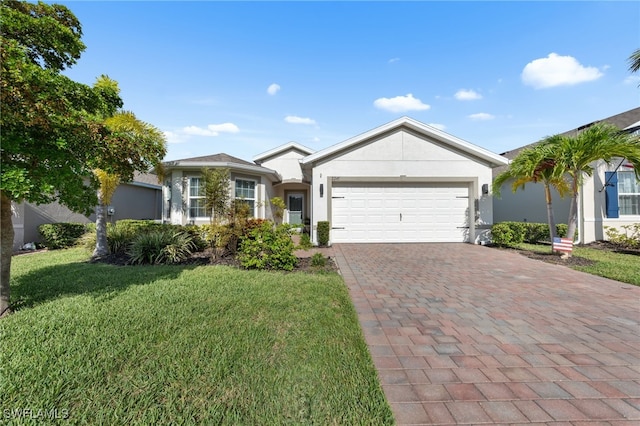 2245 Pigeon Plum Way N, Fort Myers, FL 33917 - single story home with a garage, a front lawn, stucco siding, and decorative driveway