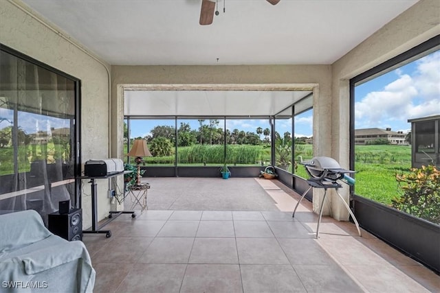 20013 Petrucka Cir N, Lehigh Acres, FL 33936 - sunroom featuring plenty of natural light and ceiling fan