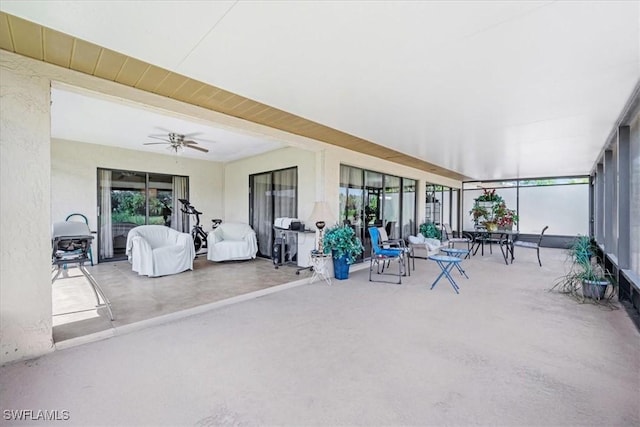 20013 Petrucka Cir N, Lehigh Acres, FL 33936 - sunroom with ceiling fan, healthy amount of natural light, and concrete floors
