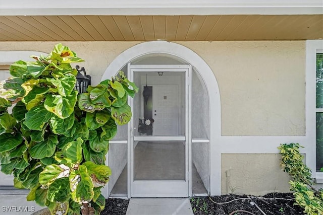 20013 Petrucka Cir N, Lehigh Acres, FL 33936 - property entrance featuring stucco siding
