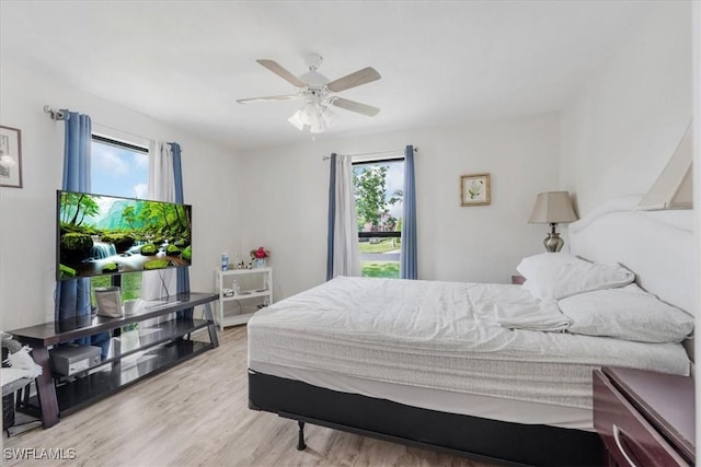 20013 Petrucka Cir N, Lehigh Acres, FL 33936 - bedroom featuring wood finished floors and a ceiling fan