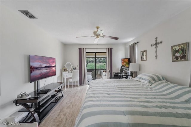 20013 Petrucka Cir N, Lehigh Acres, FL 33936 - bedroom featuring access to outside, wood finished floors, and a ceiling fan