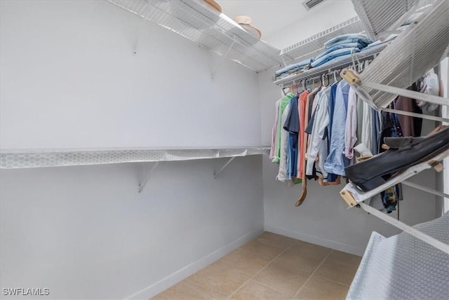 20013 Petrucka Cir N, Lehigh Acres, FL 33936 - spacious closet featuring tile patterned floors