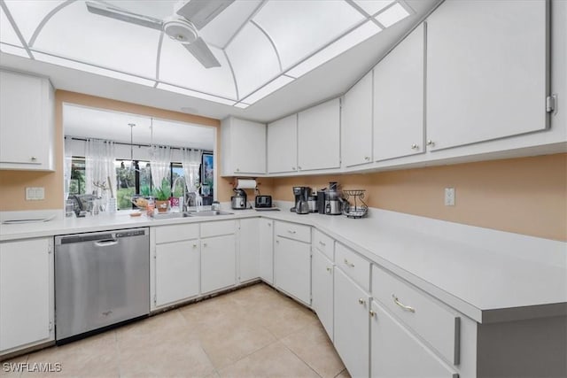 20013 Petrucka Cir N, Lehigh Acres, FL 33936 - kitchen featuring dishwasher, ceiling fan, light countertops, light tile patterned floors, and white cabinetry