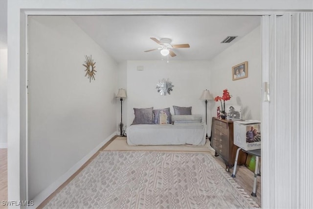 20013 Petrucka Cir N, Lehigh Acres, FL 33936 - bedroom featuring wood finished floors and a ceiling fan