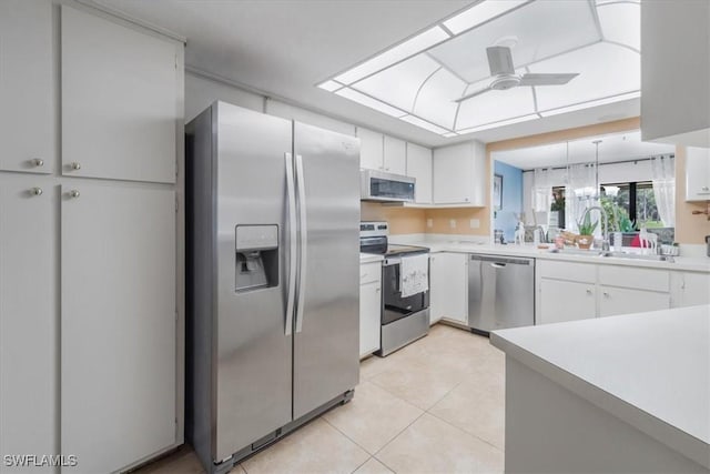 20013 Petrucka Cir N, Lehigh Acres, FL 33936 - kitchen featuring appliances with stainless steel finishes, light countertops, and white cabinets