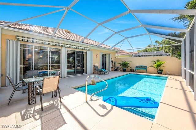 2799 Jude Island Way, Naples, FL 34119 - view of swimming pool with a patio, outdoor dining area, and glass enclosure