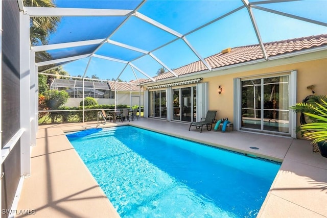 2799 Jude Island Way, Naples, FL 34119 - swimming pool with a patio, outdoor dining area, and a lanai