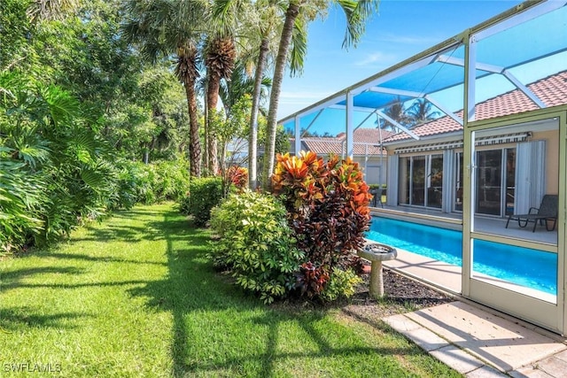 2799 Jude Island Way, Naples, FL 34119 - outdoor pool with a lawn and a lanai