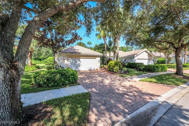 2799 Jude Island Way, Naples, FL 34119 - garage featuring decorative driveway