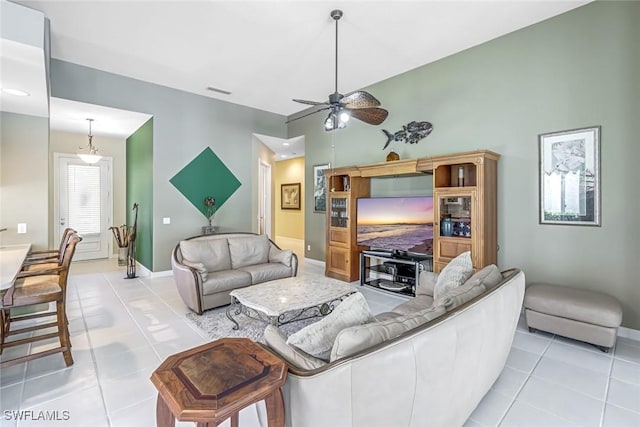 2799 Jude Island Way, Naples, FL 34119 - living area featuring light tile patterned floors and ceiling fan
