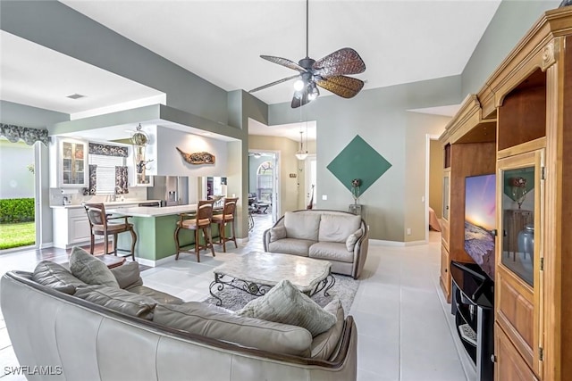 2799 Jude Island Way, Naples, FL 34119 - living area with light tile patterned flooring and a ceiling fan