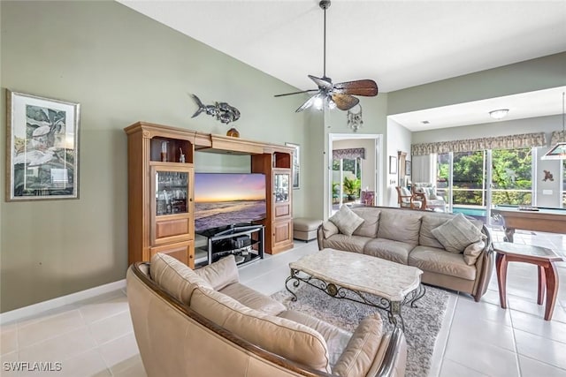 2799 Jude Island Way, Naples, FL 34119 - living area with a ceiling fan, light tile patterned floors, and vaulted ceiling