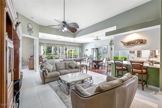 2799 Jude Island Way, Naples, FL 34119 - living room with ceiling fan and light tile patterned floors