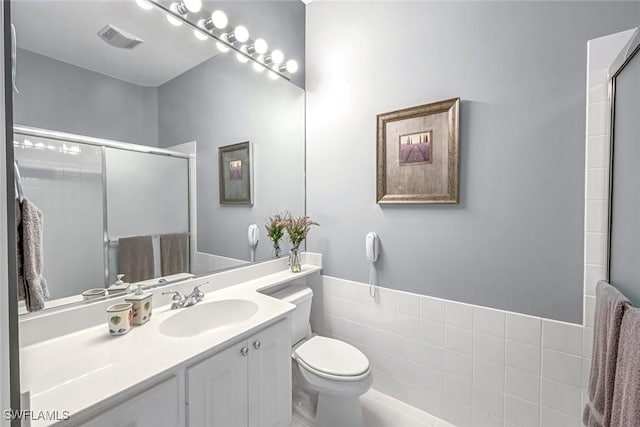 2799 Jude Island Way, Naples, FL 34119 - bathroom with vanity and a shower with shower door