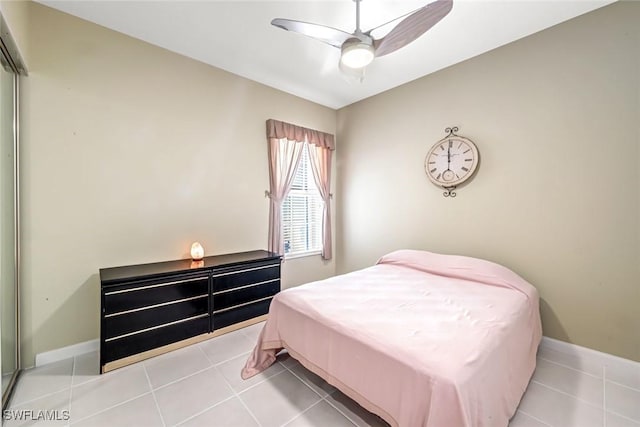 2799 Jude Island Way, Naples, FL 34119 - tiled bedroom with baseboards and a ceiling fan