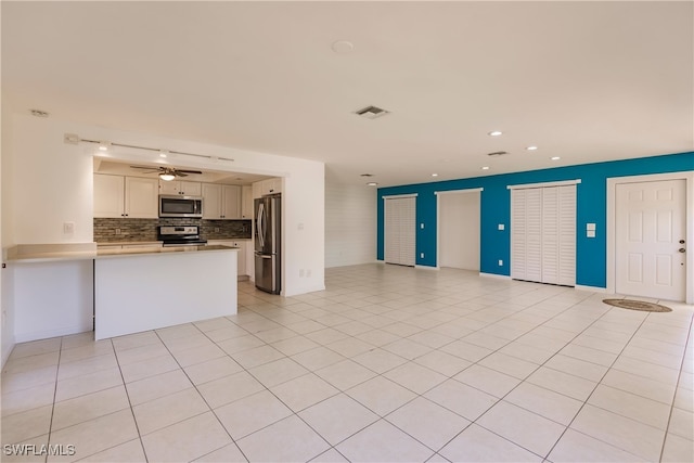 217 Yorkshire Ct Unit 2, Naples, FL 34112 - unfurnished living room featuring recessed lighting, ceiling fan, and light tile patterned floors
