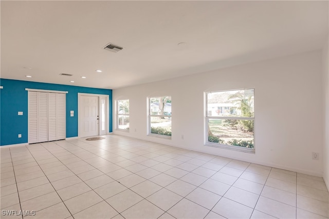 217 Yorkshire Ct Unit 2, Naples, FL 34112 - empty room with recessed lighting and light tile patterned floors