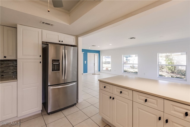 217 Yorkshire Ct Unit 2, Naples, FL 34112 - kitchen featuring stainless steel refrigerator with ice dispenser, light tile patterned floors, white cabinetry, backsplash, and light countertops