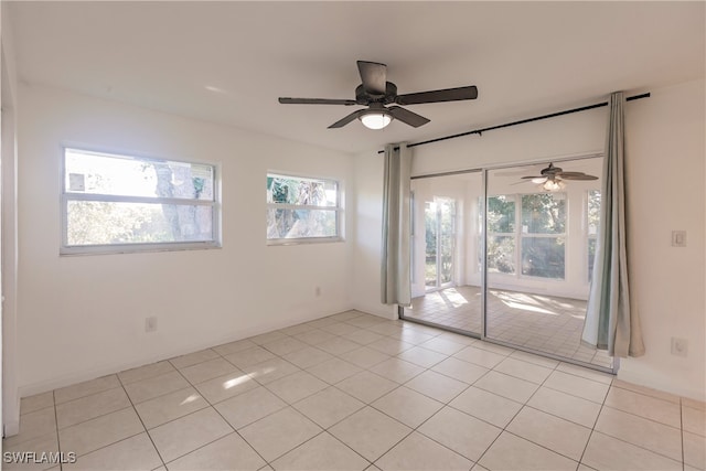 217 Yorkshire Ct Unit 2, Naples, FL 34112 - empty room featuring ceiling fan and light tile patterned flooring
