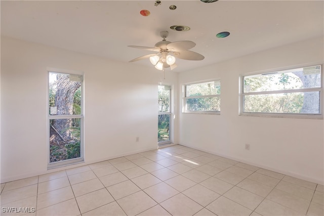 217 Yorkshire Ct Unit 2, Naples, FL 34112 - unfurnished room with a ceiling fan and light tile patterned floors
