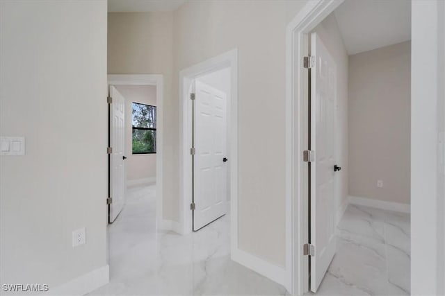 915 Anthony St E, Lehigh Acres, FL 33974 - hall featuring marble look tiles and baseboards