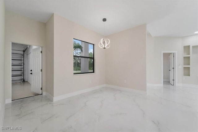 915 Anthony St E, Lehigh Acres, FL 33974 - unfurnished room featuring marble tiled floors and a chandelier