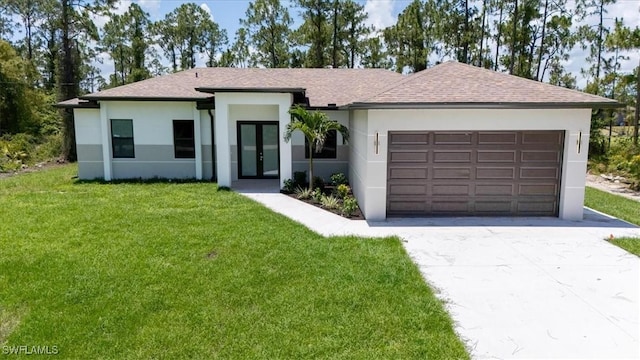 915 Anthony St E, Lehigh Acres, FL 33974 - view of front of property featuring french doors, stucco siding, driveway, and a front lawn