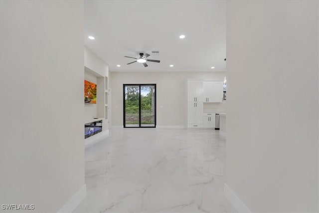 915 Anthony St E, Lehigh Acres, FL 33974 - unfurnished living room featuring light marble finish floors, recessed lighting, a ceiling fan, and a glass covered fireplace