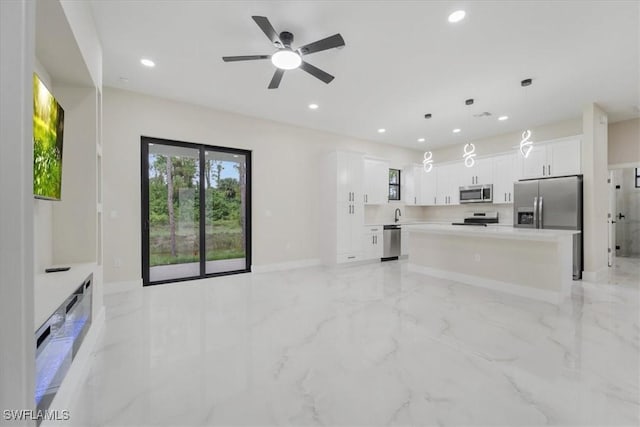 915 Anthony St E, Lehigh Acres, FL 33974 - unfurnished living room featuring light marble finish flooring, recessed lighting, and ceiling fan