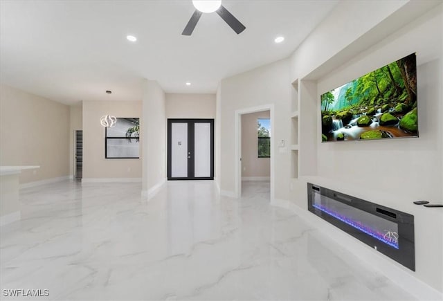 915 Anthony St E, Lehigh Acres, FL 33974 - unfurnished living room with marble tiled flooring, a glass covered fireplace, recessed lighting, and a ceiling fan