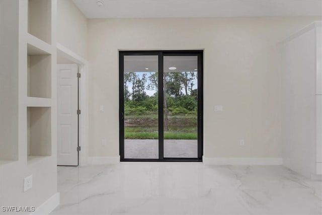 915 Anthony St E, Lehigh Acres, FL 33974 - empty room with marble finish floors and baseboards