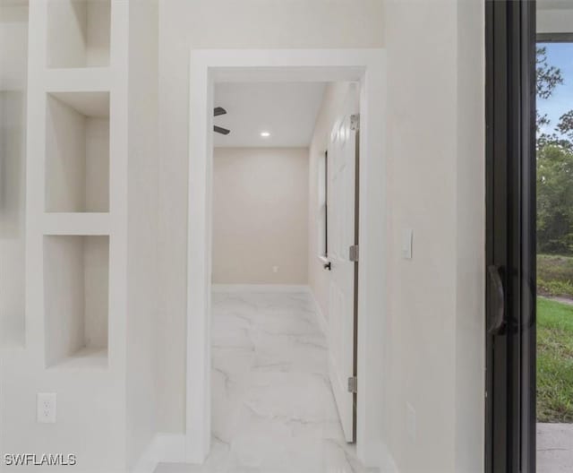 915 Anthony St E, Lehigh Acres, FL 33974 - corridor with marble finish flooring, plenty of natural light, and recessed lighting