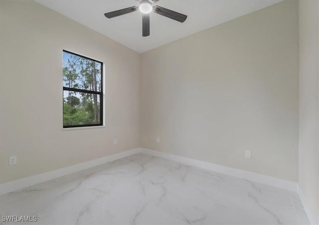 915 Anthony St E, Lehigh Acres, FL 33974 - empty room featuring marble look tile flooring and ceiling fan
