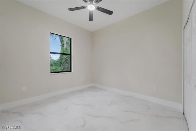 915 Anthony St E, Lehigh Acres, FL 33974 - spare room featuring marble finish flooring and a ceiling fan