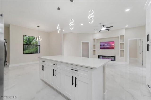 915 Anthony St E, Lehigh Acres, FL 33974 - kitchen featuring light marble finish flooring, ceiling fan, recessed lighting, light countertops, and white cabinetry
